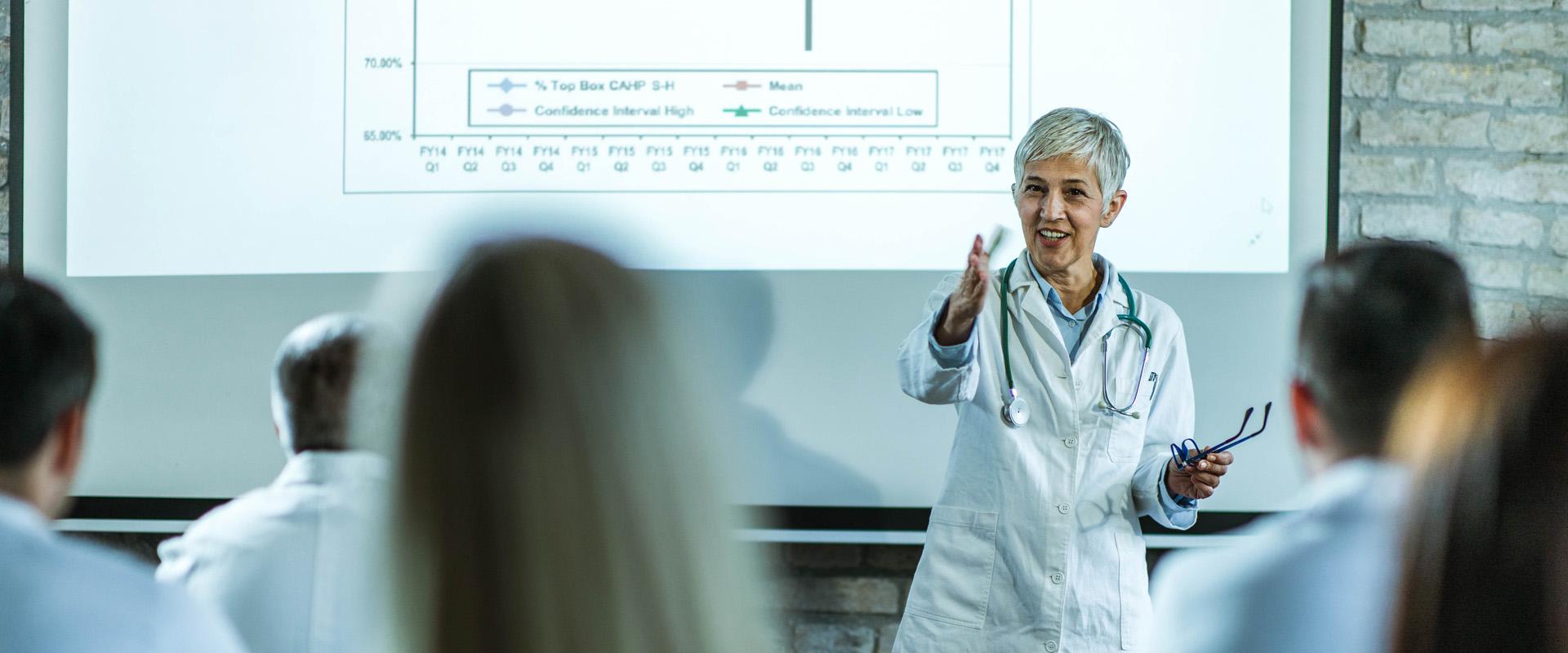 Doctor giving a presentation to group of doctors